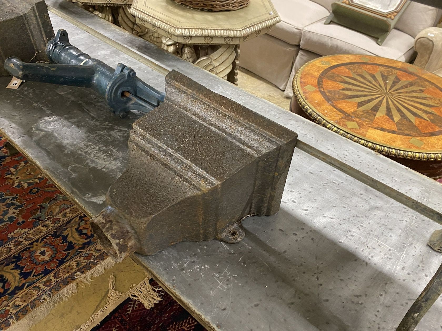 A pair of Victorian cast iron hoppers and a water pump